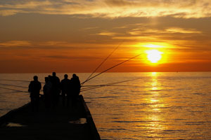 fishermen at sunset