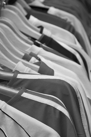 sport shirts hanging on a rack at a sporting goods store